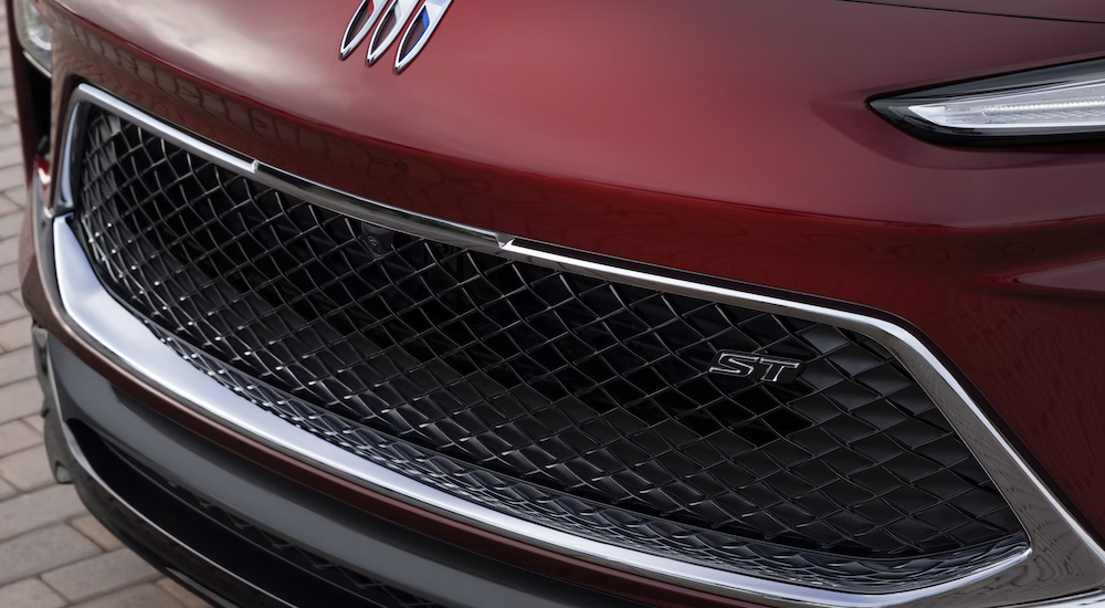 Close-up of the grille of a red 2024 Buick Encore GX ST.