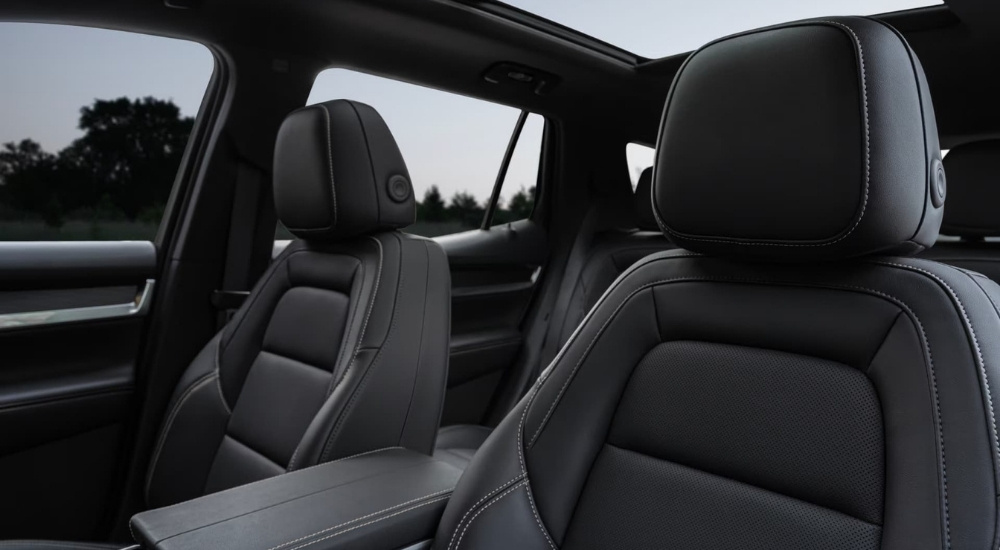 A close-up shows black leather seats in a 2025 GMC Terrain Elevation.