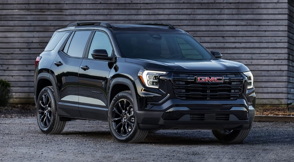 A black 2025 GMC Terrain Elevation is shown after leaving a GMC dealer near Farmington Hills.