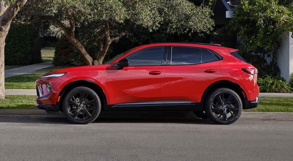 A red 2026 Buick Envision parked near a curb.