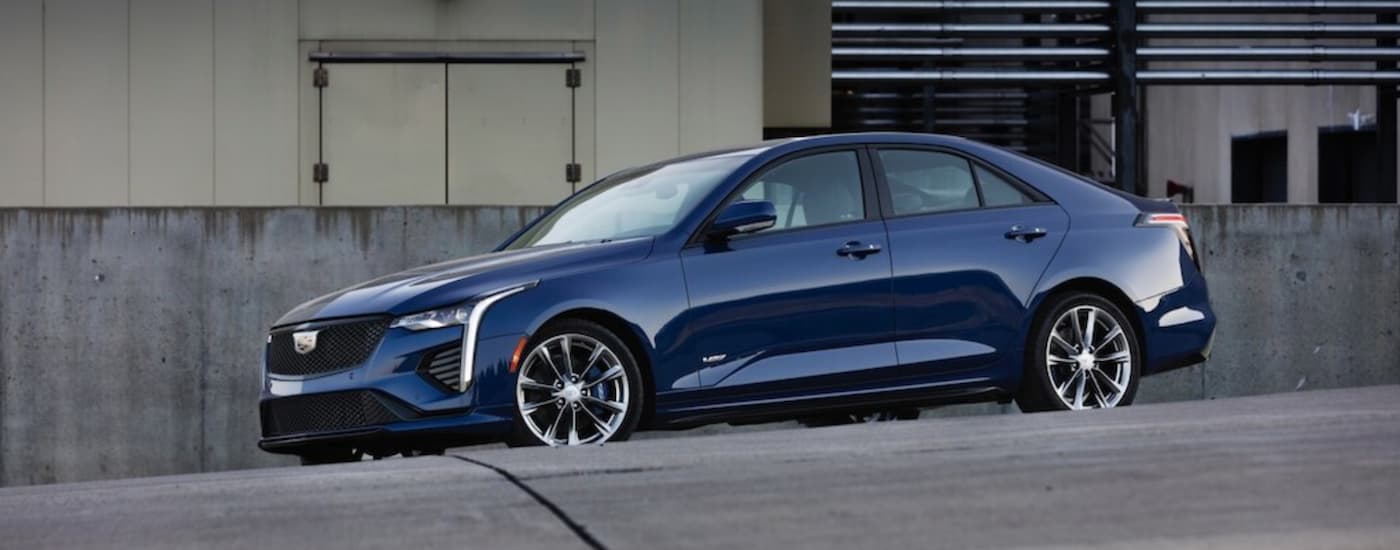 Blue 2020 Cadillac CT4 driving in a city.