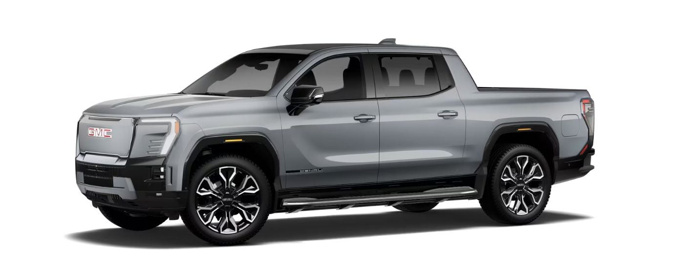 A silver 2026 GMC Sierra EV Elevation angled left.