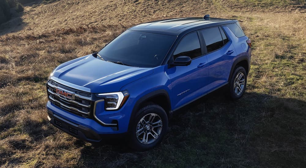 Blue 2026 GMC Terrain Elevation parked off-road.
