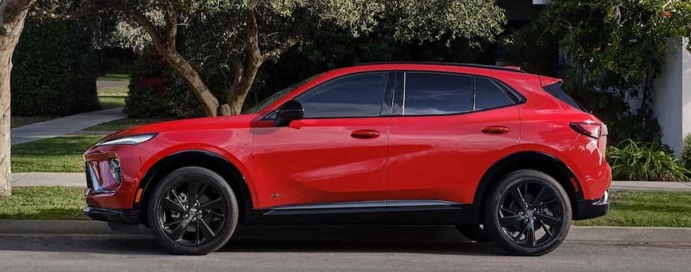 A red 2026 Buick Envision parked near a curb.