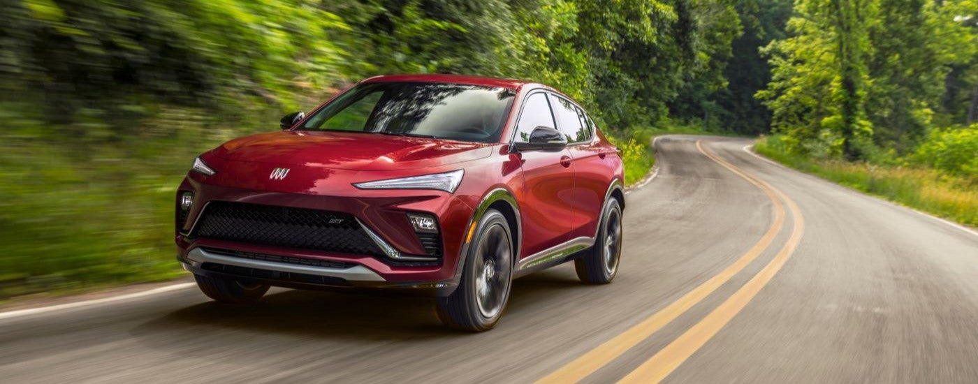 A red 2024 Buick Envista ST driving.