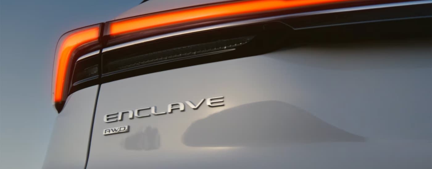 Rear of a white 2026 Buick Enclave at a Buick dealer near Flint