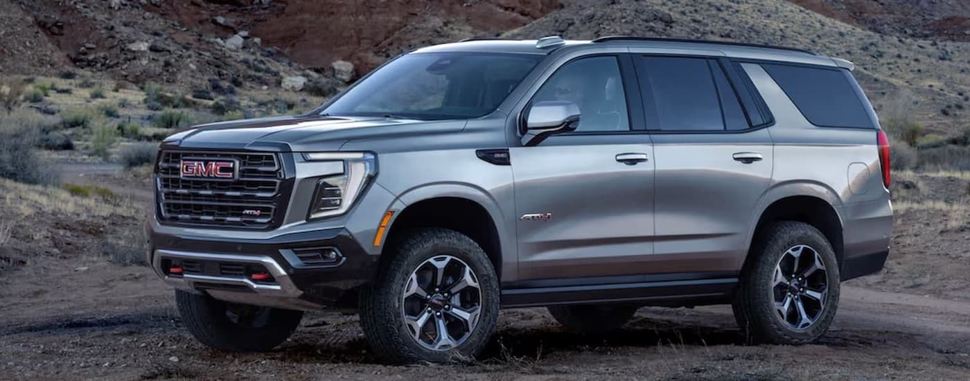 A silver 2025 GMC Yukon AT4 parked after visiting a GMC dealer near Flint.