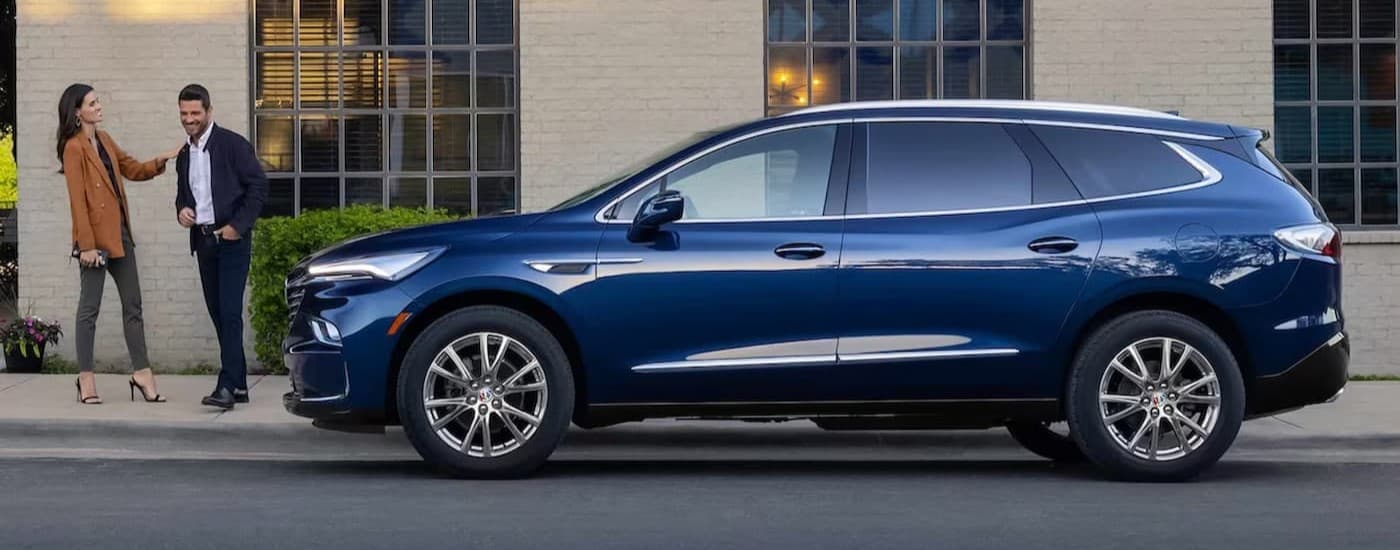 A blue 2023 Buick Enclave parked outdoors.