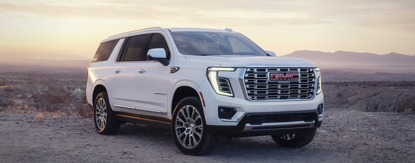 White 2026 GMC Yukon Denali parked off-road