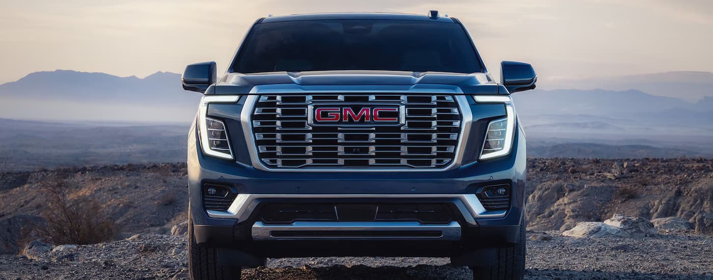 A black 2026 GMC Yukon Denali parked off-road